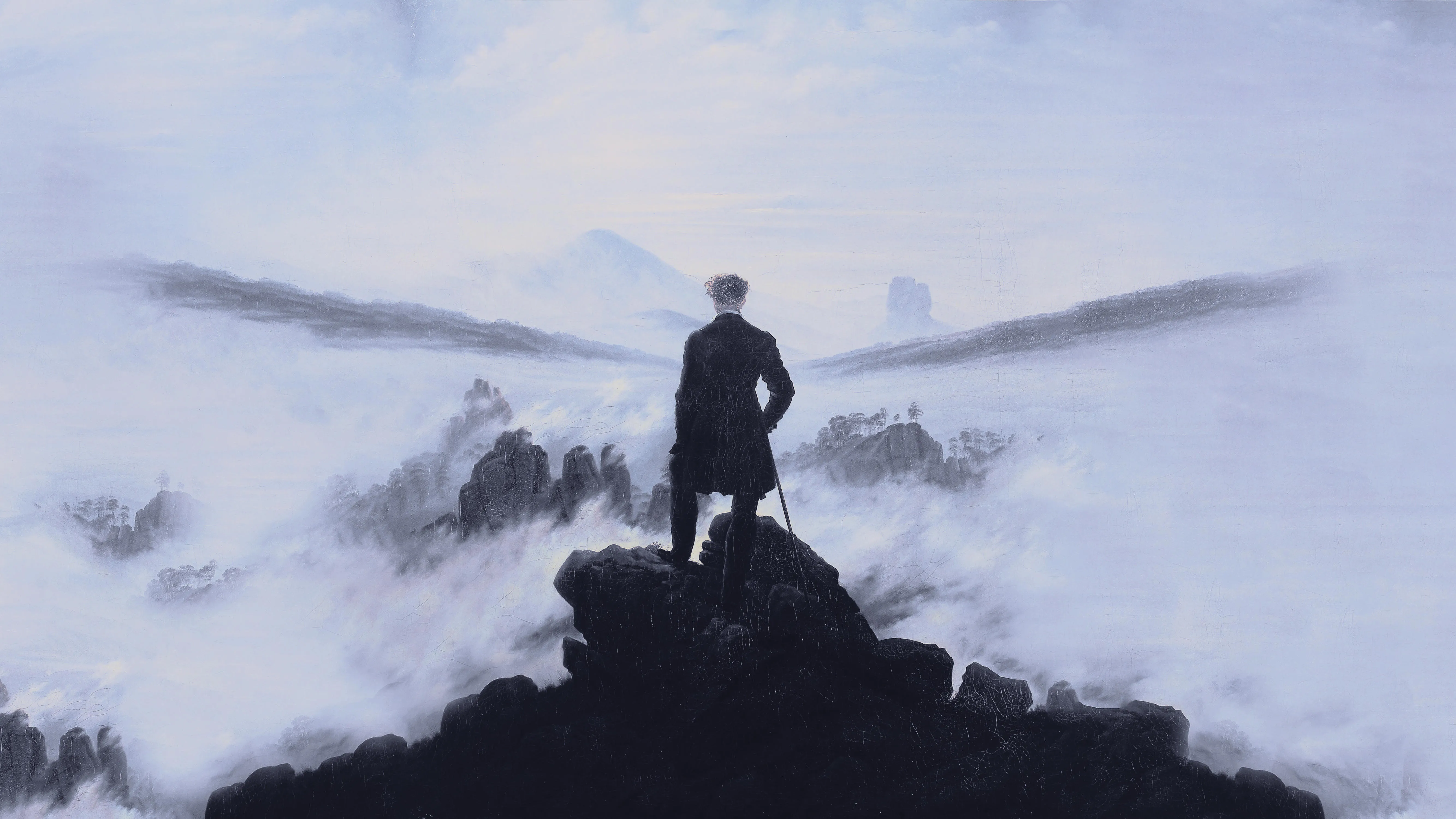 man_gazing_at_mountains.jpg