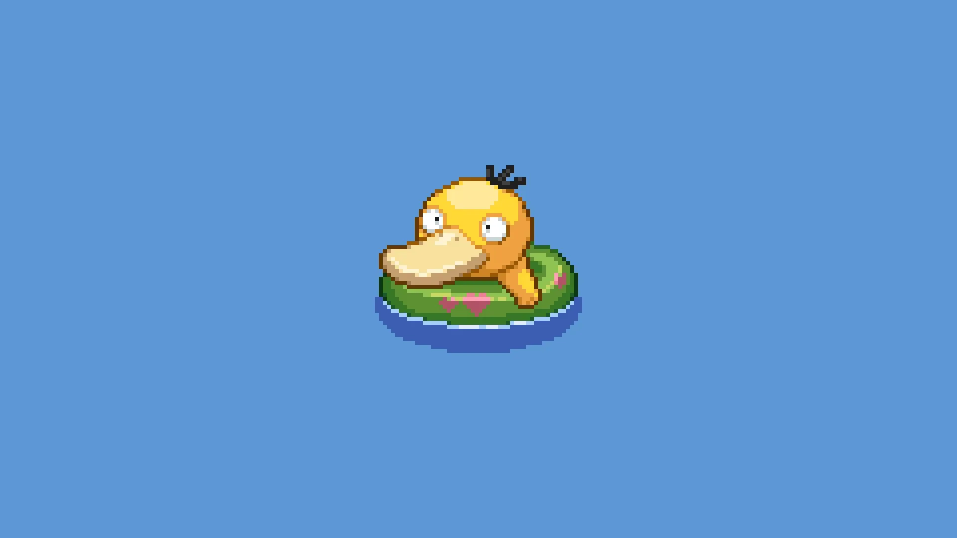 yellow_duck_floating_on_lily_pad.jpg